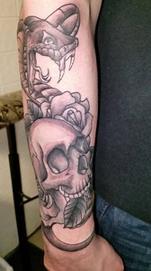 28 reactions | A snake, skull, and flowers from paul | Outlaw Tattoos & Piercing | Facebook