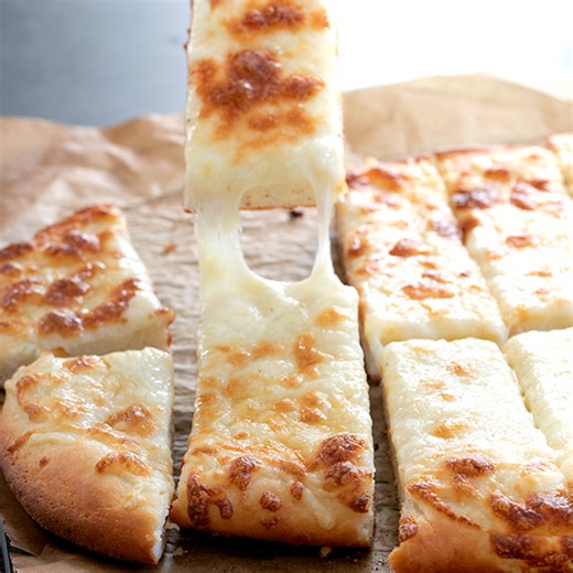 These Gluten Free Garlic Pizza Breadsticks will satisfy your craving for takeout. They make a great appetizer or side and are ready in minutes! For recipe instructions, ingredients and substitutions: https://glutenfreeonashoestring.com/garlic-gluten-free-pizza-bread-sticks/ . . . . #glutenfreeeats #glutenfreerecipe #footballfood #footballparty | Gluten Free on a Shoestring