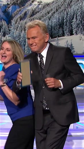 Jamie butt bumps Pat Sajak during bonus round on Wheel of Fortune