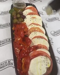Simple and delicious! Fresh mozzarella, tomatoes, basil, roasted peppers,olives & extra virgin olive oil & balsamic vinegar. | Dolce and Clemente's Italian Gourmet Market