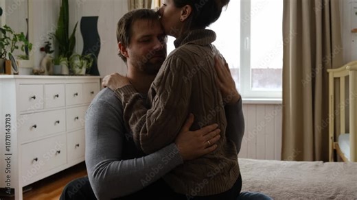 Loving mature couple interactions at home. Man and woman embracing, hugging, holding hands and dancing. Wife with husband intimate moments. couple is touching, cuddling, kissing. Natural lighting. 4K