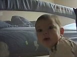 More than she can chew! Baby thinks cot cam is teething aid
