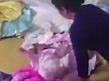 Horrific moment babysitter repeatedly hits crying baby girl | Daily Mail Online