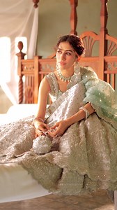 Afsaney | A bespoke bridal collection by Zainab Chottani SHAHNOOR - Exhibiting exceptional craftsmanship, this exquisite attire makes perfect choice for the wedding event. The gown is meticulously adorned with intricate handwork, creating a dreamy and ethereal appearance. Complementing the ensemble is a contrasting mint dupatta, featuring a captivating arrangement of floral motifs throughout and delicate borders on all four sides, contributing to a delicate and enchanting experience. Prepare to 