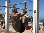 Bodybuilder does gruelling workout at Bondi Beach (related)