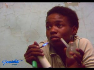 1980s. A woman smoking crack answers whether she's afraid of getting busted, raw footage