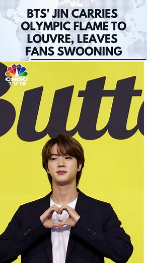 South Korean singer & member of the popular boy band BTS Jin ran past thousands of eager fans in Paris. Jin, South Korea's official torchbearer was carrying the Olympic torch to the Louvre Pyramid Museum in Paris #Paris #Olympics #BTS #Jin #Louvre #cnbctv18digital | CNBC-TV18