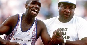 The father who helped his son cross the finish line at the Olympics has died