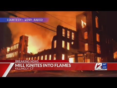 Fire rages through mill building near RI border