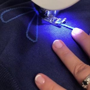 This yarn couching technique to create a beautiful sewn flower is pretty iris-istible. 🌼 Just attach the Satin Stitch Foot, select a zig-zag stitch, and sew over the yarn to form flower petal shapes as you go. Don't have a Satin Stitch Foot yet? Get yours here: http://ow.ly/hAQ350Nqx8U | Singer Sewing