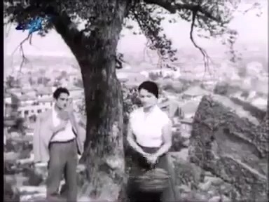 58 години от смъртта на Димитър Димов (1909 – 1966). Невена Коканова и Йордан Матев в откъс от българския игрален филм "Тютюн", 1961 г., по сценарий и режисура на Никола Корабов. Оператор е Въло Радев. Създаден е по едноименния роман на Димитър Димов. Музиката във филма е композирана от Константин Казанджиев. Българско кино | Българско кино