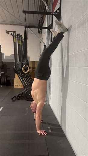 Pelvic Tilts in Handstand Hold; Against Wall