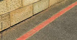 Left to right tilt pan of the Campbell Town Convict Brick Trail is a memorial to prisoners brought to Tasmania from England and shows their name, offence, and ship, Tasmania, Australia