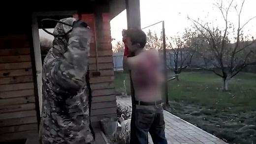 Horrific footage shows man whipped with electrical cables