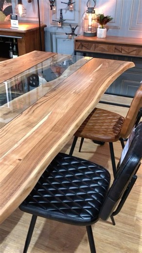 The Dalby Dining Table Made from Indian Acacia Wood and featuring a stunning glass inlay “river” centre. With a re-enforced steel frame the simplicity of this design is what makes it so impressive. Table Dims H78 x W180 x D100 #dining #diningtable #diningroom #diningroomdecor #home #homeinspo #homedecor #homedesign #acaiawood | Oswaldtwistle Mills Home and Lifestyle