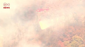 Fire crews are battling the Jennings Creek wildfire that has scorched thousands of acres along the New York/New Jersey border. Historic drought and strong winds are fueling the blaze, which has claimed the life of a volunteer forest ranger. Teams are working tirelessly from the ground and air to contain the fire and protect nearby homes. | Virgin Media News