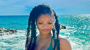 Halle Bailey shows off underboob in tiny thong bikini on beach getaway