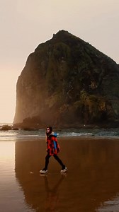 Worth chasing. Golden light spills across Cannon Beach at sunset, reminding us how special this place is. . . . 📸 @cameliyastarr #Oregon #OregonCoast #CannonBeach #HaystackRock #GoldenHour | Experience Cannon Beach