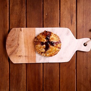 This savory pastry is stuffed with melty cheese and sweet strawberry jam. | Sugar Fix