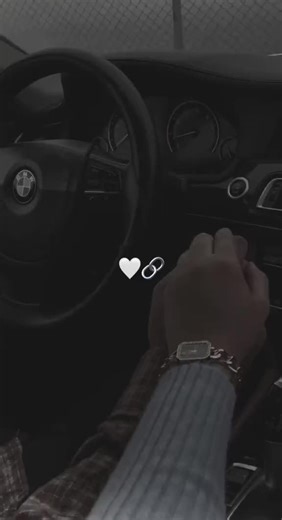 Intimate Moments: Hands Together in a Car