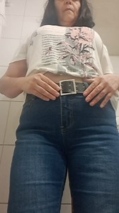 MILF taking off her clothes, urinating, leaving her vagina wet and hot.
