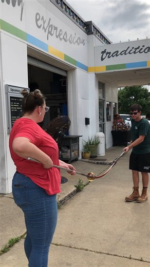 1.2K views · 30 reactions | Have you ever watched us pull cane outside of our hotshop? Check out this great cane pull by Connor Garton with the help of our wonderful staff member Christa Westbrook! Connor was our featured artist for May and we had a blast watching him work! If you missed the demonstration, check out the live recording on our YouTube or Facebook platforms. | SiNaCa Studios | Facebook