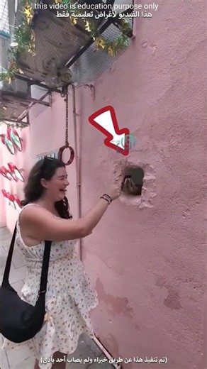 The girl put her hand into a strange hole in this wall and this is why!! #shorts