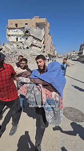 North Gaza is being Decimated by Israeli War Criminals Residents evacuate an elderly woman who was shot and injured by Israeli troops while trying to flee the Israeli atrocities in Jabalia. | Palestine International Broadcast