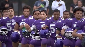Young athletes show solidarity with Kaepernick by 'taking the knee'