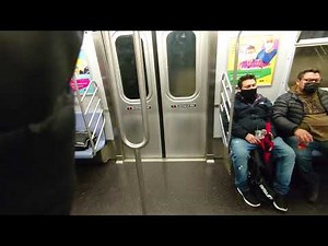 Guy on NYC subway screaming Racist slurs & threatening everyone 2021 January 15 - E train to Queens