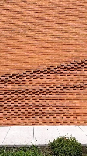 Parametric Architecture on Instagram: "The undulating brick façade, designed by @behetbondziolinarchitekten in Munster, Germany, imitates the movement of draped fabric. The intention of the design was to allude to the association’s work with fabric of which the structure houses. (🎥 @ehoweler) #brick #brickarchitecture #brickfacade #parametricarchitecture #parametricdesign"