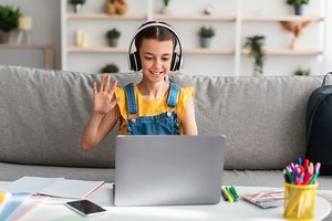 Cheerful Schoolgirl Sitting at Table, Using Laptop, Waving To Pc Stock Photo - Image of online, conference: 234785752
