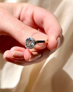 3.3K views | My personal favorite mounting style, a bezel or also called collet-setting is a bit of metal that wraps and protects the entire edge of the stone. A bezel is fairly foolproof and rarely needs repairing. Ideal for someone that would want to wear their ring daily and is perhaps more active or works with their hands (item 4030). https://erstwhilejewelry.com/collections/new-arrivals/products/1-28-carat-art-deco-diamond-solitaire-engagement-ring | Erstwhile | Facebook