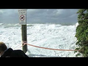 Mother Nature sneaks up on weather presenter Josh Holt at Dee Why beach in Australia
