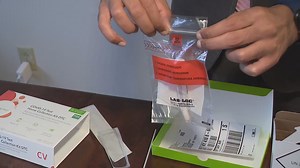 Pharmacies stocking shelves with at-home COVID test kits