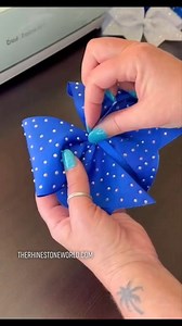 Making a cheer bow with a Cricut, rhinestones and Magic Flock template material. Find bow templates here: https://www.therhinestoneworld.com/rhinestone-cheer-bow-design-bundle-download #rhinestones #rhinestoneideas #rhinestonetemplates #rhinestonebling #cricutrhinestones #rhinestoneswithcricut #cricutmade #craftasmr #asmrcrafts | The Rhinestone World