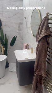That feeling of wrapping yourself in a snug dressing gown that’s been warming on the heated towel rail after a shower on a cold night 😝 Next move? Pop the kettle on. Explore home heating at https://bit.ly/476CTeX #cosy #nightsin #autumnthings #coldnights #heatedtowelrail | Bath Shack