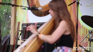 Mesmerized by Mikaela Davis absolutely ripping the harp on a gorgeous Saturday afternoon on the beach of Paradise Lakes at this past years #BFX 😍🏹🏖️🌞 ~ We’re getting closer & closer to #beardfest2023 y’all! | Beardfest