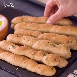 Treat yourself to our irresistible Homemade Breadsticks! 🙌🔥✨ These golden delights are the perfect companion to any meal or a delightful snack on their own. Recipe: https://www.homecookingadventure.com/homemade-breadsticks/ | Home Cooking Adventure