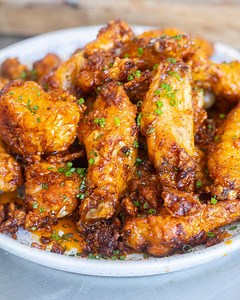 #AD Nothing beats a deep-fried crispy chicken wing. They are incredibly crunchy, coated in a sticky, fiery honey and Bull's-Eye BBQ Louisiana Chipotle Hot Sauce. Topped with some fresh chives. These are going to go down a treat. Full recipe: https://www.mobkitchen.co.uk/recipes/crispy-honey-chipotle-wings. Tune by Akshin Alizadeh. #MOBKitchen #Chicken #BullseyeBBQ #CookStrong | Mob