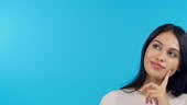 Beautiful mixed race woman standing alone in the studio and looking...