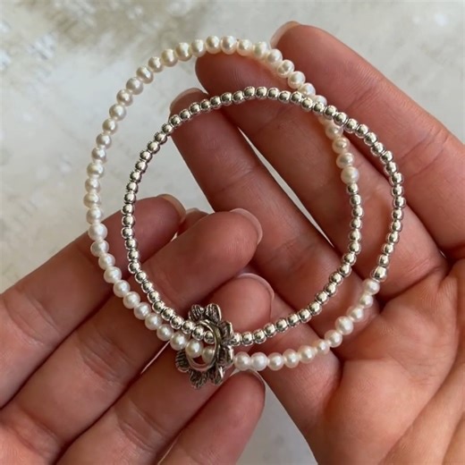 Don't miss this unique wrap-style stretch bracelet featuring sterling silver beads, freshwater pearls, and a silver 🌸 pendant! Twice Shy Bracelet just $59.99 (MSRP $139.99) today only while supplies last - Must enter code SPRING for an extra 20% off! Shop now: https://bit.ly/TwceShy | Inspiranza Designs