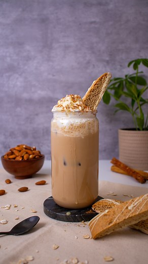 Iced Cinnamon Roll Latte #nonnispartner Nonni’s Bakery Biscotti are the perfetto pairing for any at-home coffee recipe! The Cinnamon Streusel Biscotti has a delicious cinnamon and sweet icing taste that pairs so perfectly with the brown sugar and oat milk in the latte🤎🤌🏽 Take a moment to indulge and enjoy a relaxing coffee biscotti moment with @nonnisfoods Here’s what you need: ● 1 tbsp brown sugar ● 2 espresso shots ● 1 cup (8 ounces) oat milk ● Ice ● Whipped cream ● Cinnamon ● White chocola