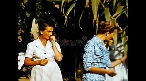 Man with Film Camera Shoots People in the Garden from the 50s Stock Footage - Video of operator, digital: 257845450