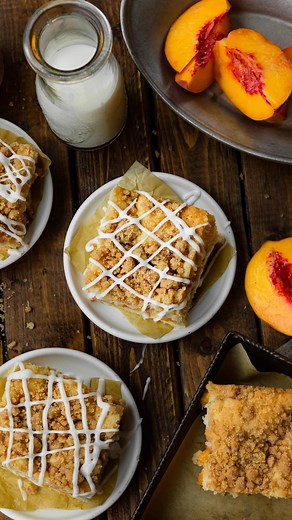 🍑PEACH WEEK🍑 This Peach Coffee Cake with streusel topping is our go-to late summer treat! 🍑 ✨ Moist vanilla cake, juicy peaches, and crunchy cinnamon streusel come together in this easy recipe. Use fresh or canned peaches—either way, you’ll love the soft, buttery cake with a sweet vanilla glaze. RECIPE: ohsweetbasil.com/peach-coffee-cake-streusel-topping/ #ohsweetbasil #cannedpeaches #freshpeaches #peachcoffeecake #summerbaking #dessertlovers #fruitdessert #coffeecake | Sweet Basil