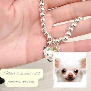 Have your four legged friend with you always on a beautiful silver beaded photo bracelet, engraved with your pets real photo. You can also opt to have an extra charm added, this customer chose a feather charm 💛 Simply upload your photo to the product page and I'll.do everything else for you 😊 Shop here: https://www.gemzbyemz.co.uk/product/silver-beaded-photo-bracelet-2/ | Gemz By Emz