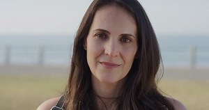 clip-1013095316-portrait-attractive-mature-woman-laughing-enjoying-warm