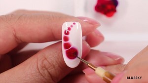 Ladies create unique designs with only three components: blossom base coat, blossom gel, and nail art brush. Each blossom design will be one of a kind like every one of your clients. Classy effect on their fingertips! #blueskyproducts #blossomgel | BlueskyProducts