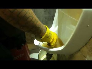 How to unclog a plugged urinal without removing it from the wall.