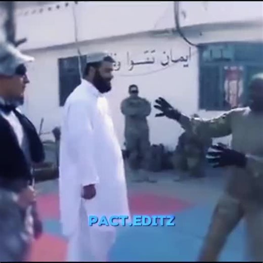 US Marine Shares Combat Tips with Afghan Man